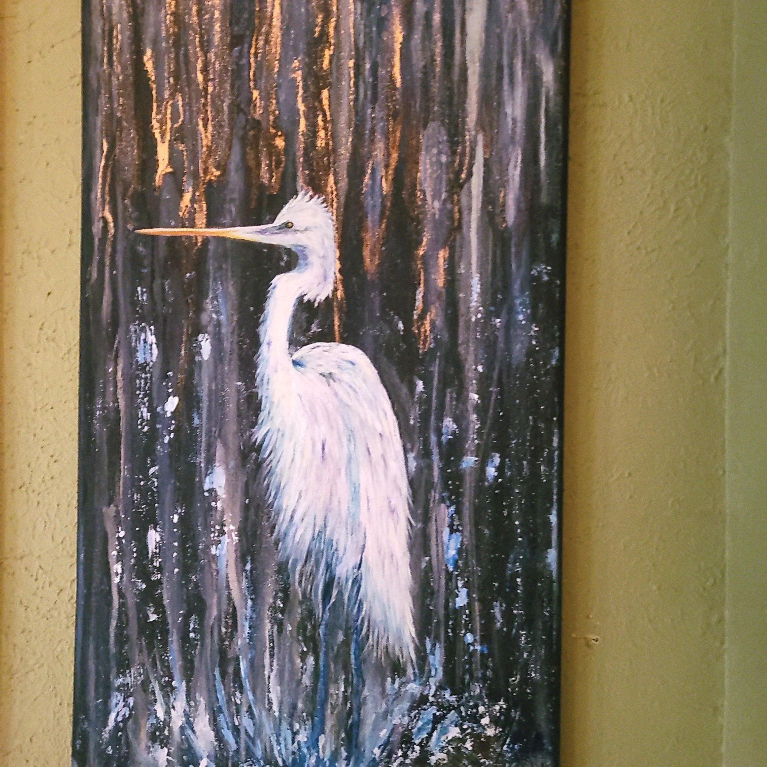 A stunning artwork of a white heron, created using alcohol ink and acrylic painting techniques, displayed on a wall. Produced by The Artful Lynk, Fine Art by Lynda Krupa.