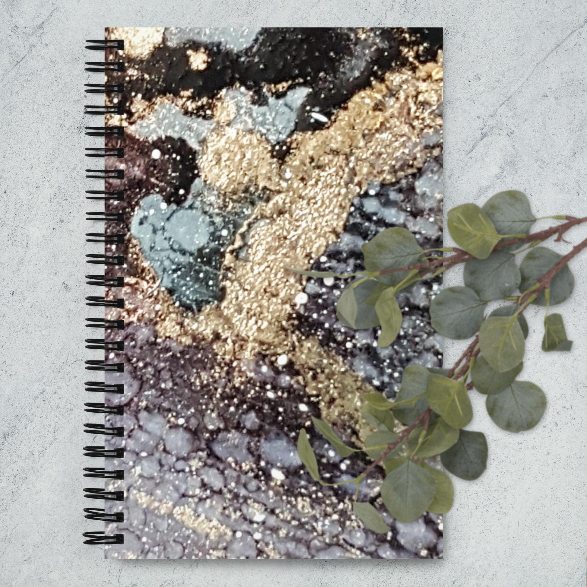 Immerse yourself in the elegant world of abstract art with this granite-inspired spiral notebook
