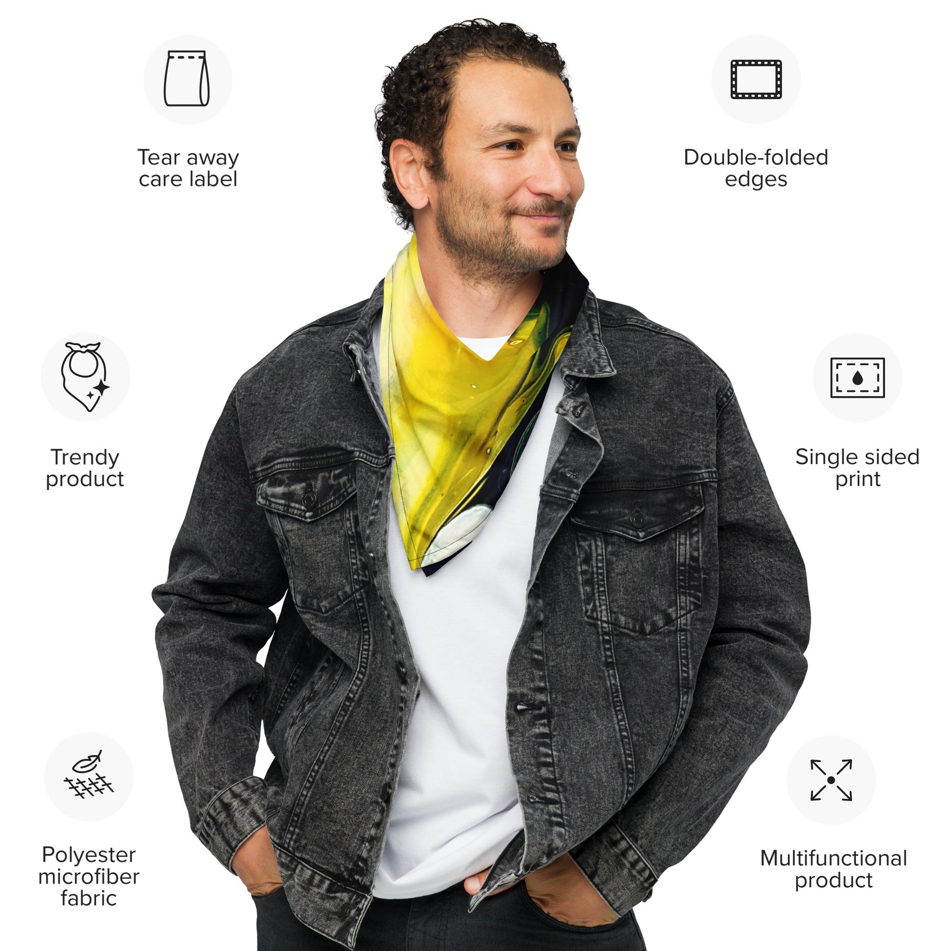 A man in a denim jacket is wearing The Artful Lynk, Fine Art by Lynda Krupa's all-over abstract print bandana head scarf hair tie securely wrapped around his neck.